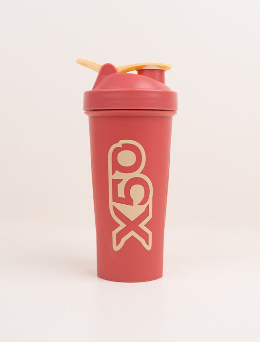 X50 red shaker bottle with yellow lid and bold logo, designed for mixing supplements and promoting health and wellness.